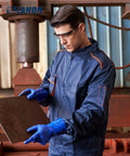 Man wearing Workhorse PVC Chemical Resistant Gloves 6 Pairs Grippy Non Slip Rubber Work Gloves For Acid Alkali And Oil Protection Blue Large