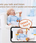 Baby drinking from bottle monitored by 1080p WiFi Indoor Security Camera For Pet And Baby Monitor With Easy Setup and Smartphone App
