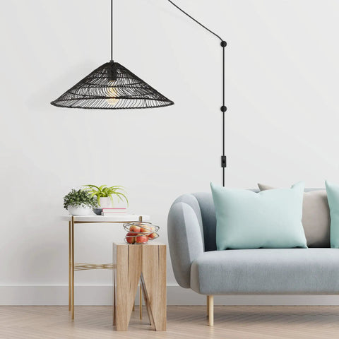 Black 1 Light Farmhouse Coastal LED Pendant With Rattan Cone Shade For Kitchen Island, Dining Room Or Bedroom, Plug In Or Hardwired Swag Lamp, 20.25 Inch Height, 180 Inch Cord, Energy Saving LED Bulb Included hanging over a modern living space.