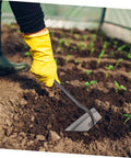 Garden hoe loosening soil, part of a 4-Piece Garden Hoe Set For Weeding And Soil Loosening, Durable Hand Tools For Digging