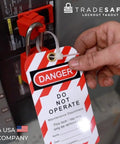 Heavy Duty Lockout Tagout Tags With Nylon Zip Ties Osha Compliant Danger Do Not Operate Signs applied to a locked breaker.