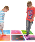 Children standing on Liquid Sensory Floor Tiles 15.8 Inch Square 4 Pack Colorful Fun Non-Toxic Liquid Moves With Every Step