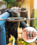 Close-up of Heavy Duty M8 X 60mm Eye Bolts Set In 304 Stainless Steel With Lock Nuts held in hand, outdoor background