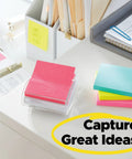 Kickass 3x3 Inch Pop Up Dispenser Notes 12 Pack on a desk, featuring colorful sticky notes for capturing great ideas.