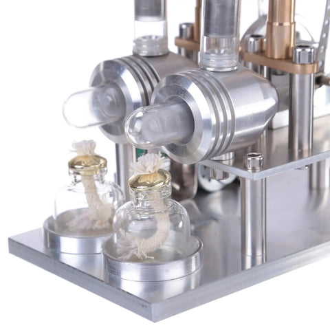 Detailed view of Top-Tier Stirling Engine Generator Model Set 3 twin-cylinder brass and aluminum setup with glass vessels.