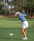 Golfer using Mevo Plus GPS Launch Monitor And Golf Simulator With Multicam Tracking on outdoor range