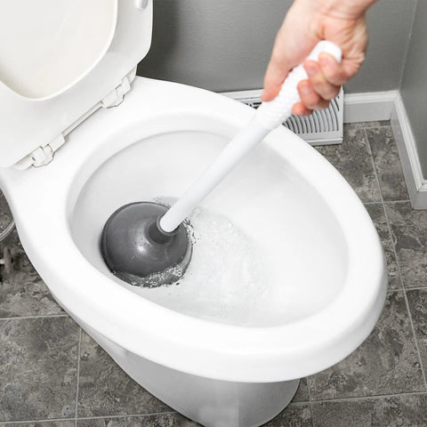 Heavy Duty Toilet Plunger With Extended Flange And Portable Caddy in action, gray rubber cup creating suction in a toilet.