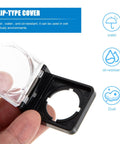 Hand holding Anti Touch Button Cover With Flip Lid Safety Guard For Industrial Workshop And Hospital Use, clear view of hinge.