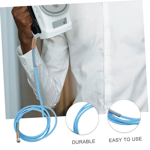 Person holding steam iron connected with high temperature steam iron hose replacement for easy ironing, durable and flexible.
