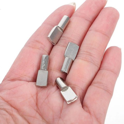 Five Heavy Duty Stainless Steel Shelf Pegs 150 Pcs 5mm Nickel Finish Flexible Adjustable Shelf Support Pins in hand for wood and glass shelves