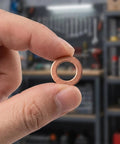 200 Piece Copper Crush Washer Set Metric Assortment With 9 Sizes For Oil Water And Fuel Lines Durable Copper Flat Washers With High Conductivity And Heat Tolerance Seals Tight And Prevents Leaks For DIY Projects. Copper washer held between fingers