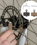 Mountain Bike Disc Brake Pads, 4 Pairs, Lightweight Semi Metallic Replacement Kit For Hydraulic Systems installed on wheel