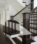 Close-up of staircase with 96 Pack Iron Baluster Shoes With Screws For Half Inch Square Balusters Satin Black No-Fuss Install.