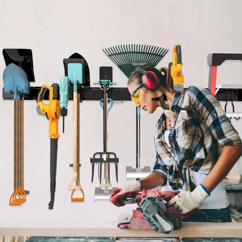 Heavy Duty Garage Storage Rack System Wall Mounted Tool Organizer With Eight Double Hooks And Three Rails For Garden Tools Brooms Rakes Shovels Ski Gear And More Fits Standard Two By Four Stud Spacing in use with tools attached