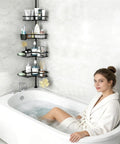 Corner Shower Caddy Tension Pole 4 Tier Rustproof Shelves next to bathtub with toiletries, adjustable floor standing bath rack holder.