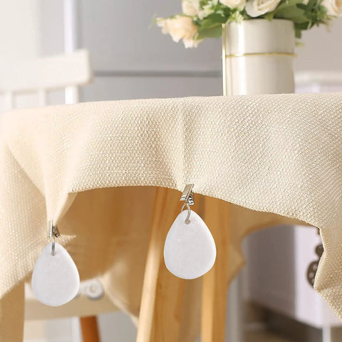 12 Piece Teardrop Marble Tablecloth Weights With Metal Clips White For Indoor Outdoor Use, clipped on cream tablecloth edge