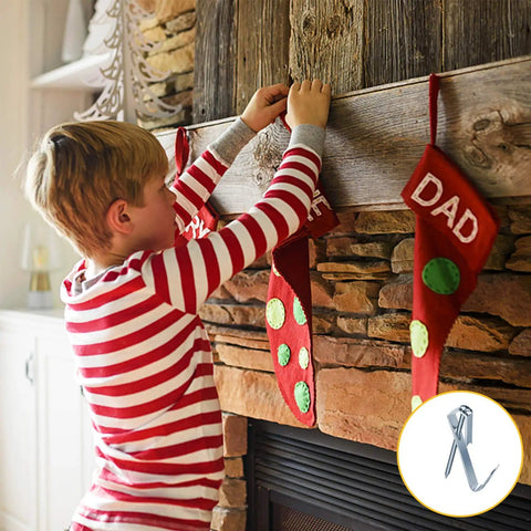 Child in striped pajamas hanging a stocking on a mantel, with Picture Hanging Kit With 100 Hangers And 120 Nails inset image.