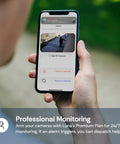 Person holding phone with 2K QHD Security Camera for Indoor and Outdoor Use app showing surveillance footage and options.