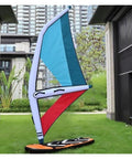 Inflatable Windsurf Wing for Wind Foiling and Snow Skiing, dope durability, shown upright on lawn near buildings.