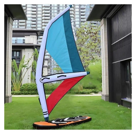 Inflatable Windsurf Wing for Wind Foiling and Snow Skiing, dope durability, shown upright on lawn near buildings.