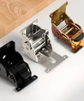 Set of three industrial locking 90-degree folding hinges for tables/workbenches in black, silver, and gold-tone metal.