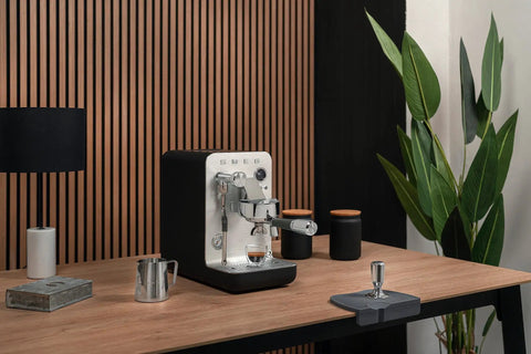 Next Level Semi Pro Espresso Machine Featuring 15 Bar Pump Pressure And Triple Thermoblock Heating For Rock Solid Temp Control And Strong Steam Wand Pulling Real Deal Barista Shots Daily In Glossy Black on a wooden table.