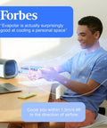 EvaCHILL Portable Air Conditioner Compact Personal Evaporative Cooler And Desk Fan on desk with man enjoying cool air