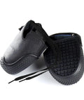 Badass Steel Toe Shoe Covers With Non Slip Oil Resistant Soles And Thick Leather Lining For Heavy Duty Industrial Safety And ASTM EN ISO Certified Impact Shielding on black shoe covers with textured soles.