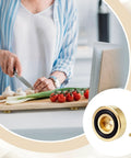 Woman chopping vegetables on a board with Solid Brass Cutting Board Feet With Grippy Silicone Pads keeping it stable.