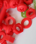 No Sweat 20 Piece Red Polypropylene Fastener Kit M6 X 60mm Phillips Pan Head Bolts With Nuts And Washers close-up of red bolts, nuts, and washers.
