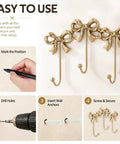 Heavy Duty Gold Bow Knot Wall Hooks Dope Brass Triple Coat Hanger mounted on wall with installation steps displayed.