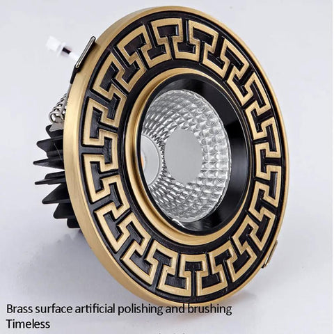 Close-up of premium brass recessed lighting trim kit with decorative pattern, part of Rock Solid 9 Pack Recessed Lighting Trim Kits.