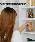 Woman reaching for jar of grains in kitchen pantry, showcasing storage alongside Beast 2000W Grain Grinder Mill With 550g Capacity Stainless Steel High Speed Pulverizer For Dry Wheat Oats Corn Pepper And Coffee Beans Home Kitchen Workhorse.