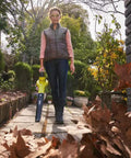 Person standing outdoors with No Sweat Heavy Duty 18V Cordless Yard Leaf Blower with comfy grip for leaf cleanup