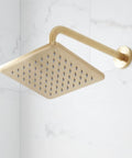 Berwyn Pressure Balance Shower System with Slide Bar and Hand Shower - Brushed Gold square shower head mounted on wall.