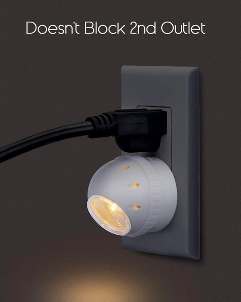 Plug In Night Light With Dusk To Dawn Sensor, 360 Degree Rotation, showing light in use without blocking second outlet