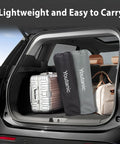Car trunk packed with camping gear and travel suitcases, showcasing the portability of the Beefy Heavy Duty Oversized Camping Chair With Side Pocket And Cup Holder Portable Folding Outdoor Chair For Adults Up To 400 Lbs Perfect For Fishing Sports Camping And Weekend Trips.