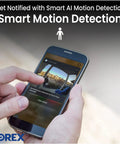Hand holding phone displaying notification from 2K Indoor WiFi Security Cam With Magnetic Base And Flexible Mount Pet And Baby Monitor Infrared Night Vision Person Detection Two Way Talk 16GB MicroSD Included No Monthly Fee.
