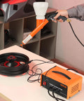 Vevor 50Kv Electrostatic Powder Coating Kit With Foot Switch And Spray Gun For Home Diy Projects Heavy Duty Equipment showing spray gun in use.