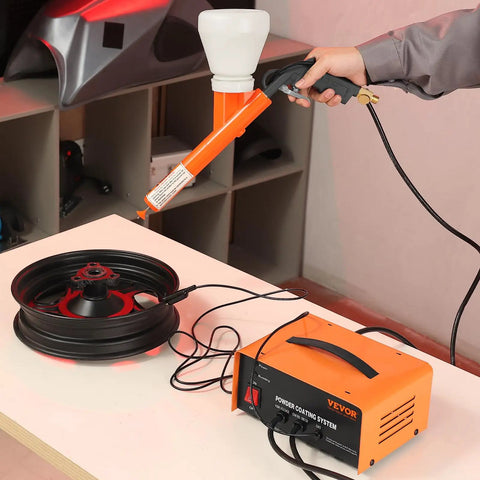 Vevor 50Kv Electrostatic Powder Coating Kit With Foot Switch And Spray Gun For Home Diy Projects Heavy Duty Equipment showing spray gun in use.