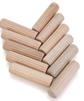 100 Count Solid Wood Dowel Pins Half Inch By Two Inch Kiln Dried Hardwood Fluted Beveled arranged in a pile, showing variety in color.