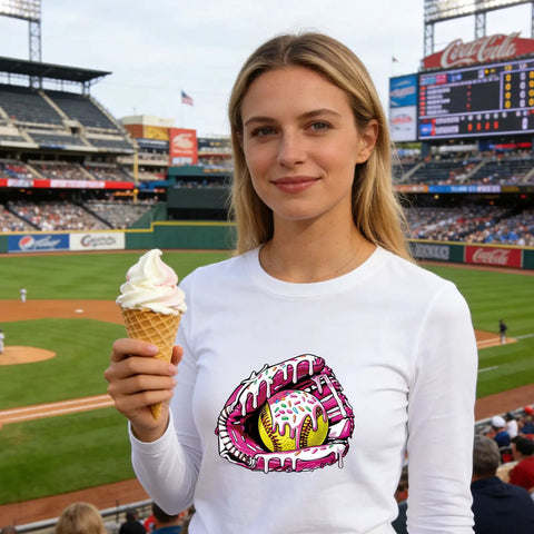 Woman wearing white shirt with ice cream drip baseball design at stadium, holding ice cream, showcasing DTF Transfers Ready To Press 30 Sheets Ice Cream Drip Baseball Iron On Patches For T Shirts Funny Sports Heat Transfer Decals For Clothes DIY Fabric Great For DIY Clothing.