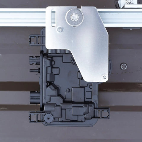 Top Shelf Micro Inverter With Standard Mc4 Connectors designed for 320 To 540 Watt Solar Panels, mounted view with silver bracket.
