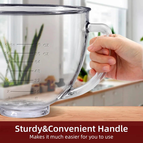 Hand holding a clear measuring cup with handle, placed on a kitchen counter.
