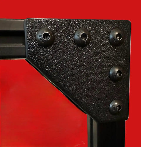 8 Piece 2020 Series Corner Brackets for 20mm x 20mm aluminum extrusion, black PLA, 5 holes for M5 screws, installed view.