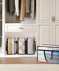 Roomy Clear Storage Sacks, Heavy Duty 60L Zippered Packing Bags For Seasonal Clothes And Bedding stacked in a closet.