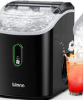 Real Deal Chewable Nugget Ice Maker Countertop Self Cleaning Fast Freeze Pellet Machine Cranks Out Thirty Six Pounds Daily Compact Black Gizmo filled with ice ready for drinks.