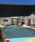 Pool area with a 90 Percent Shade Cloth For Dog Kennels And Outdoor Spaces Heavy Duty Sunblock Shade Mesh Tarp providing sun protection