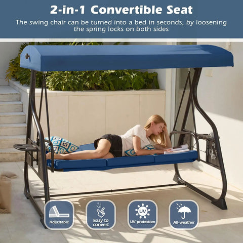 Woman relaxing on Three Seat Patio Porch Swing With Canopy And Adjustable Backrest, Outdoor Glider with Stand, blue canopy.
