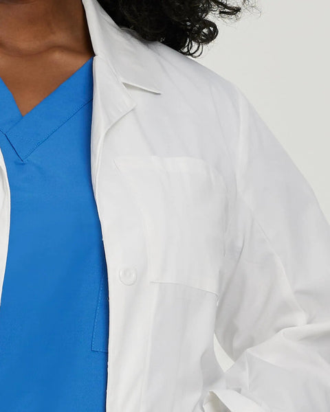 Detail of Relaxed Fit Five Pocket Three Button Full Length White Medical Lab Coat For Women over blue scrubs.